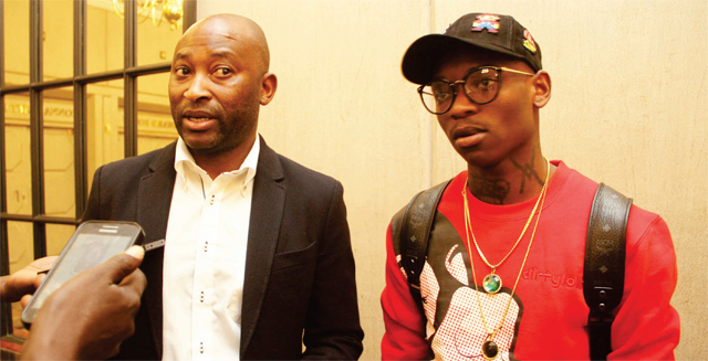 CLEARING THE AIR…Zimbabwe football legend Peter Ndlovu (left), who is also Mamelodi Sundowns team manager, addresses the local media in Harare yesterday in the company of Warriors star Khama Billiat who was assessed by national team doctors who ruled him out of Sunday’s 2019 AFCON qualifier against Liberia.