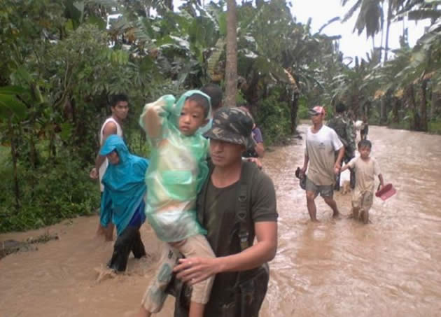 Security forces pour into typhoon-hit towns