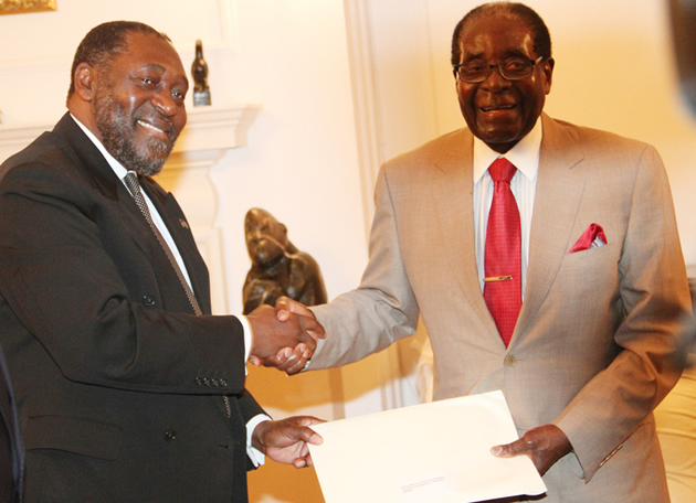 President Mugabe receives a special message from Malawian Minister of Labour and Manpower Development Mr Henry Mussa at State House in Harare yesterday