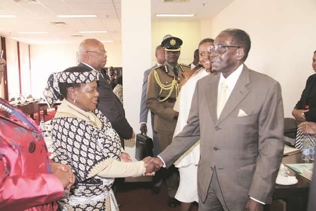 Prsident Mugabe and the First Lady Amai Grace Mugabe, who is also Zanu-PF secretary for Women’s Affairs, greet Politburo members Cdes Jacob Mudenda and Edna Madzongwe at the Zanu-PF Politburo meeting in Harare yesterday
