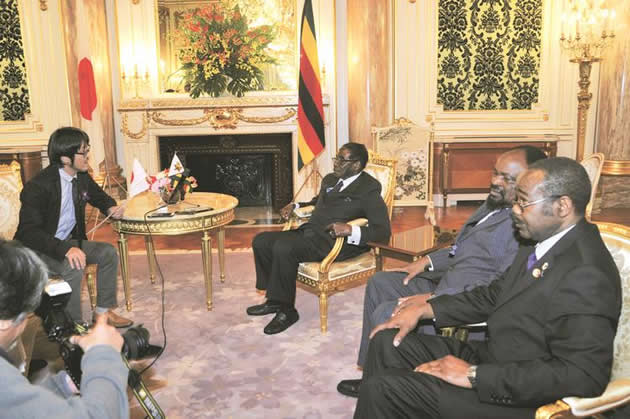 President Mugabe fields questions during an interview with Japanese journalists in Tokyo yesterday while Foreign Affairs Minister Simbarashe Mumbengegwi and Zimbabwe’s Ambassador to Japan, Retired Air Vice Marshal Titus Mehliswa Jonathan Abu-Basutu, listen.- Picture by Presidential photographer Joseph Nyadzayo