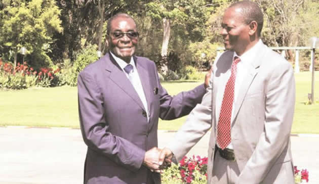 President Mugabe congratulates newly-appointed Minister of Rural Development, Preservation and Promotion of Culture and Heritage Abednico Ncube after the swearing in ceremony at State House in Harare on Monday