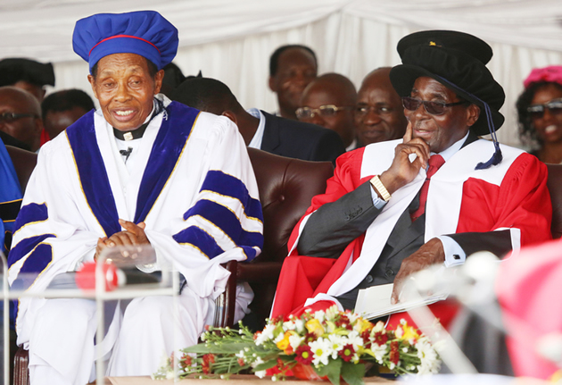 President Mugabe chats with Zimbabwe Ezekiel Guti University Chancellor Professor Ezekiel Guti at the official opening of the new institution in Bindura on Friday. — (Picture by Believe Nyakudjara)