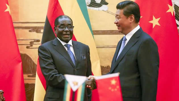 ALL-WEATHER-FRIENDS. . . President Mugabe shakes hands with his Chinese counterpart President Xi Jinping during his State visit to China