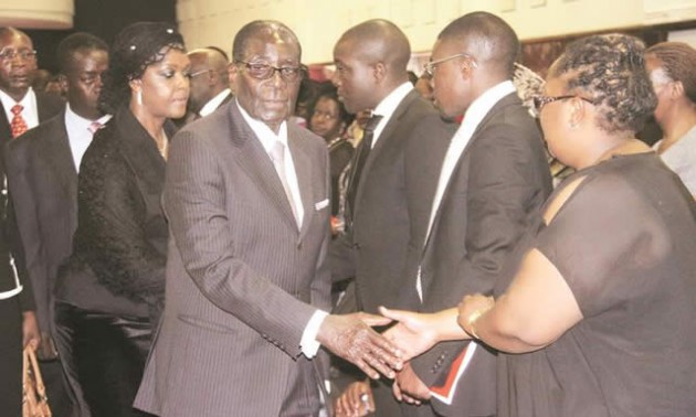 President Mugabe and the First Lady Amai Grace Mugabe console mourners, among them Nombuyiselo Dube, the daughter of national hero Cde Khotsho Dube who was buried at the National Heroes Acre yesterday