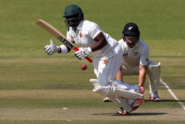 SHOWING THE WAY . . . Zimbabwe debutante Prince Masvaure sets off for a run during his impressive show on the first day of the first cricket Test against New Zealand at Queens yesterday. — AFP