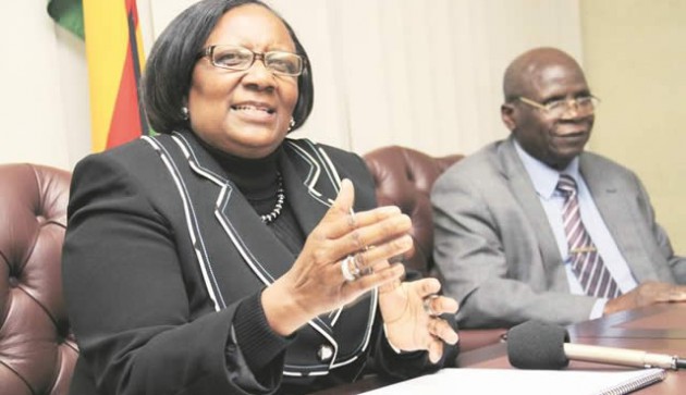 Public Service, Labour and Social Welfare Minister Prisca Mupfumira addresses journalists at a Press conference while the permanent secretary Mr Ngoni Masoka looks on
