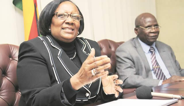Public Service, Labour and Social Welfare Minister Prisca Mupfumira addresses journalists at a Press conference while the permanent secretary Mr Ngoni Masoka looks on