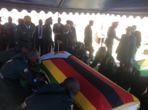 Pallbearers place the body of national hero, Brigadier-General Zingoni on his tomb (pic by Lloyd Gumbo).