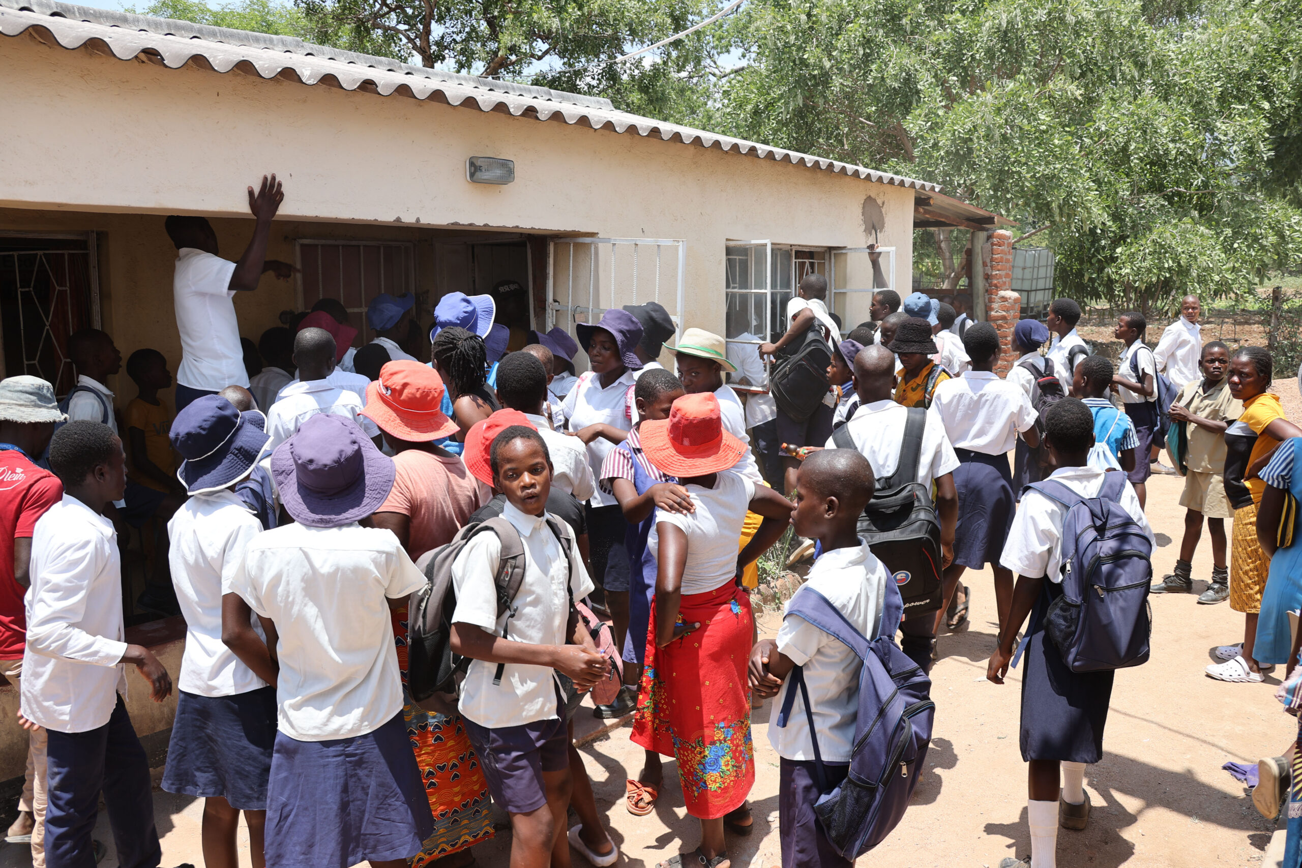 Parents are joined by their children as they demonstrate at Hotsprings Secondary School over satanism allegations. — Pictures: Tinai Nyadzayo