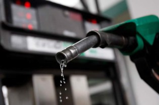 Petrol drips from a gasoline pump at a petrol station in London-904585