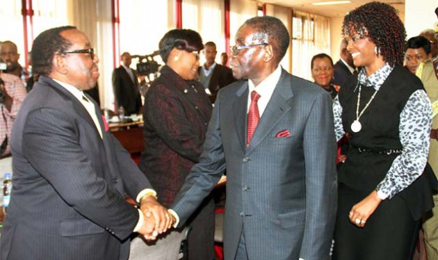 President Mugabe greets zanu-pf secretary for Information and Publicity Cde Simon Khaya Moyo while First Lady Dr Grace Mugabe shares a lighter moment with Cde Oppah Muchinguri-Kashiri before a Politburo meeting in Harare yesterday. — (Picture by John Manzongo)