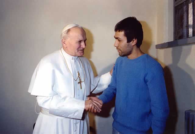 Former Pope John Paul II (L) greets Mehmet Ali Agca at Rebibbia prison on December 27, 1983 in Rome. Agca attempted to kill pope John Paul II on May 13, 1981 – AFP.