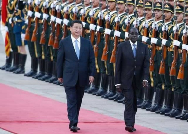 President Mugabe and his Chinese counterpart Xi Jinping inspect a guard of honour during the former’s State visit to China last year. President Xi is expected in Harare in December