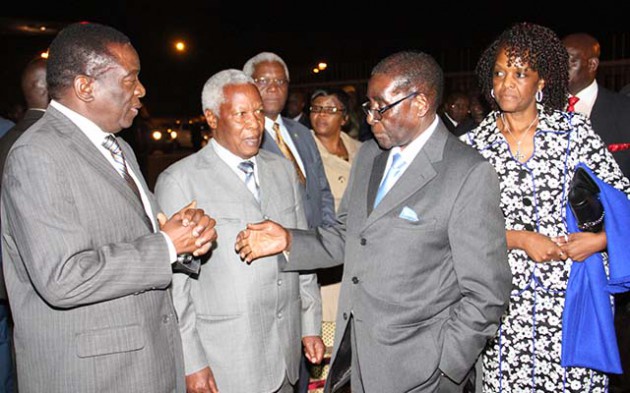 President Mugabe chats to Vice President Emmerson Mnangagwa and Defence Minister Dr Sydney Sekeramayi while First Lady Dr Grace Mugabe and Home Affairs Minister Dr Ignatius Chombo looks on before their depature at Harare International Airport early this morning.  - Picture by John Manzongo