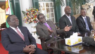 Presedent Mugabe flanked by GNU principals.
