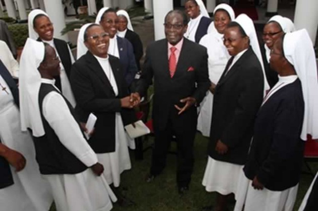 President Mugabe shares a lighter moment with the Roman Catholic Church’s Missionary Sisters of the Precious Blood at State House in Harare yesterday. —(Picture By Justin Mutenda)