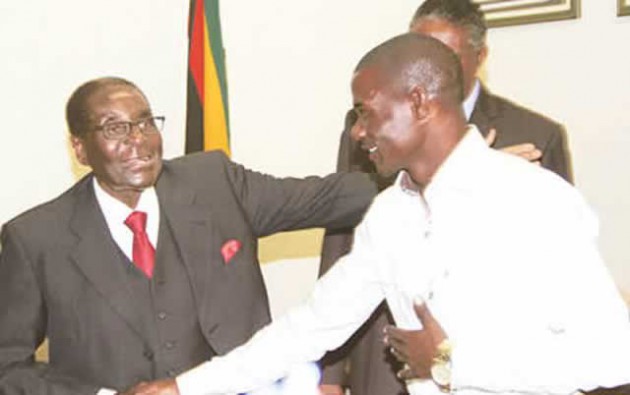 President Mugabe shares a lighter moment with World Boxing Council welterweight bronze champion Charles Manyuchi at his Munhumutapa offices in Harare yesterday. Looking on is Vice President Phelekezela Mphoko (partially obscured)