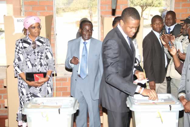 President Mugabe and First Lady Amai Grace Mugabe watch while Robert Junior cast his vote at Mhofu Primary School polling station in Highfield - (Picture by Believe Nyakudjara)