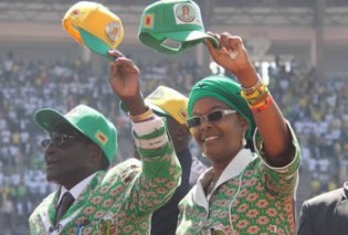President Mugabe and the First Lady Amai Grace Mugabe greets Zanu-PF supporters on arrival at the National Sports Stadium