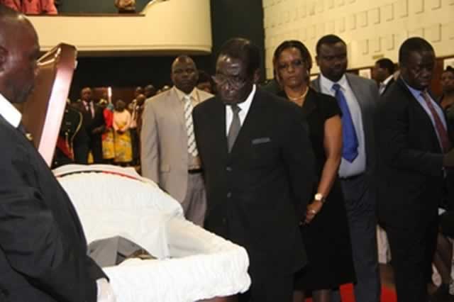 President Mugabe and the First Lady Amai Grace Mugabe view the body of Cde Enos Nkala at Stodart Hall in Mbare, Harare, yesterday before burial at the National Heroes’ Acre. — (More pictures on Page 6 and Comment on Page 9)