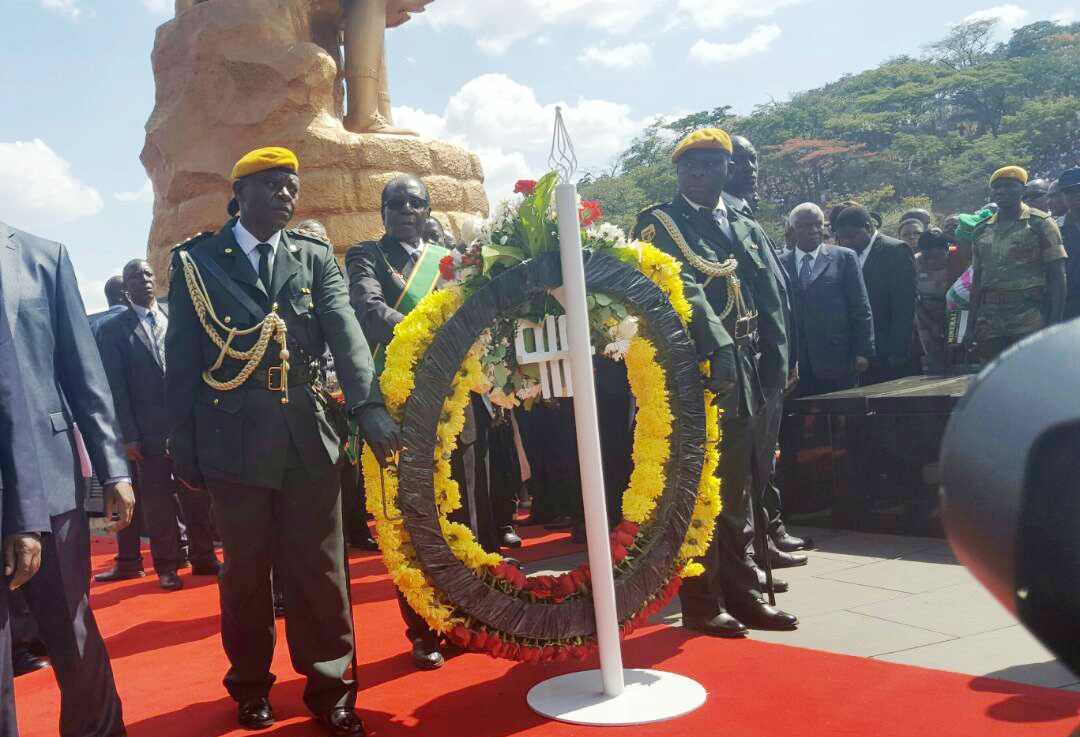 President Mugabe prepares to lay the wreath at the tomb of the unknown soldier.