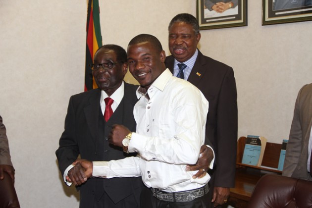 President Mugabe meets Charles Manyuchi today while VP Mphoko looks on.