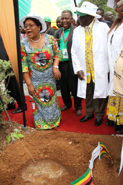 President Mugabe share a lighter moment with VP Mujuru and Amai Grace Mugabe after planting their trees in Chinhoyi.