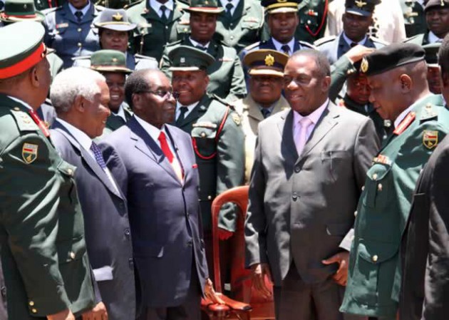 President Mugabe flanked by Vice President Emmerson Mnangagwa, Defence Minister Sydney Sekeramayi (second left), Zimbabwe Defence Forces Commander General Constantine Chiwenga (left) and Zimbabwe Staff College Commandant Brigadier-General Josphat Kadumba after a graduation ceremony at the college in Harare yesterday. — Picture by John Manzongo