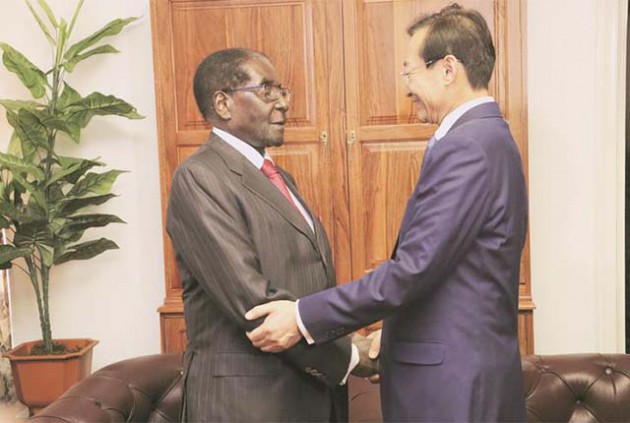 President Mugabe welcomes Chinese Vice Foreign Affairs Minister Zhang Ming at his Munhumutapa offices in Harare last week