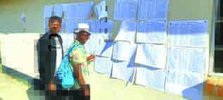 Prospective voters check their names on the voters roll at Lawrencedale Primary School in Headlands. — Picture: Samuel Kadungure