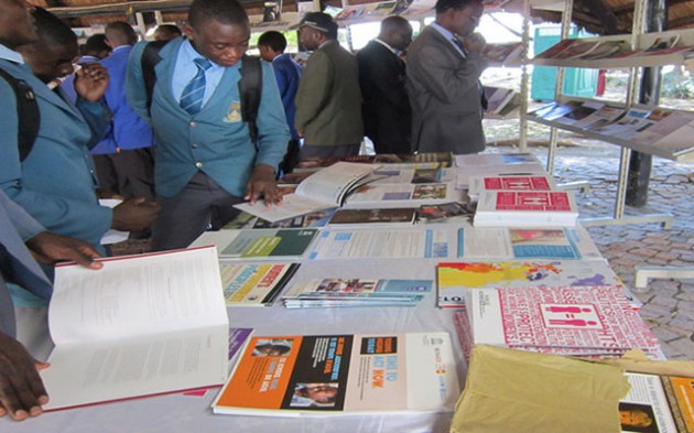 Pupils view books at ZIBF 2016