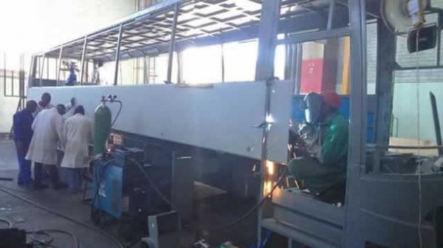 Technicians assembling a bus at Quest Motors in Mutare