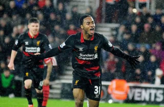 Raheem Sterling celebrates after scoring Liverpool’s second goal