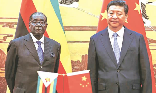FLASHBACK . . . President Mugabe poses for a photograph with his Chinese counterpart Xi Jinping during his visit to China last year