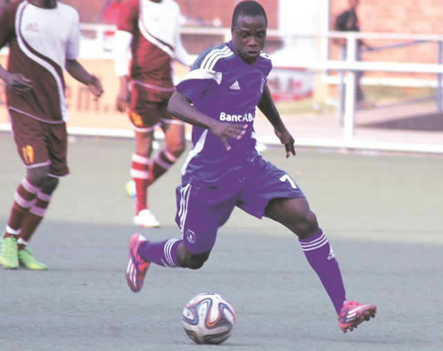 ROLLING STONE . . . Ronald Chitiyo works his way past Shabanie Mine midfielder Rowan Nenzou (out of picture) during yesterday’s match at Rufaro. — Picture by Justin Mutenda