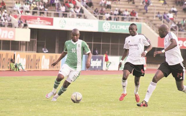 GET READY TO BE ROASTED BOYS . . . CAPS United’s striker and man-of-the-match Tafadzwa Rusike (left) takes on Highlanders players Rahman Kutsanzira and Eric Mudzingwa (right) during yesterday’s Castle Lager Premiership soccer match at the National Sports Stadium. — (Picture by Kudakwashe Hunda)