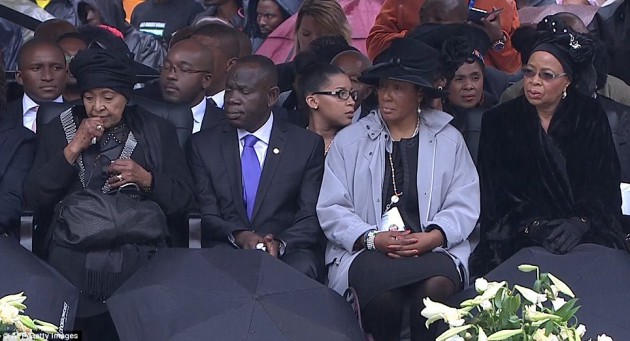 Relatives:Mr Mandela's  ex-wife Winnie Mandela Madikizela (left) and his widow Graca Machel take their seats in the stadium-Daily Mail