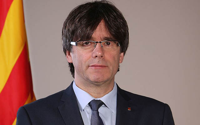 Catalan leader in German court as arrest ignites protests