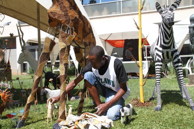 Ronald Savanhu arranging his artwork for exhibition at HIFA yesterday