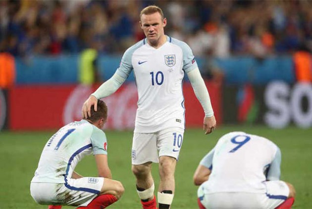 Wayne Rooney (centre) and his team-mates look dejected after losing their last 16 European Championship game to Iceland on Monday night