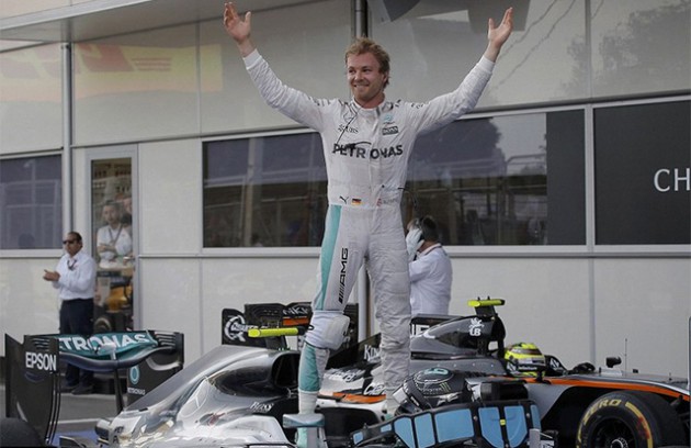 NUMERO UNO . . . Nico Rosberg celebrates by climbing on his Mercedes and holding his arms aloft after winning the European Grand Prix in Baku. — DailyMail