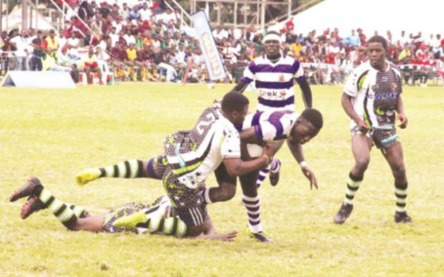 NO WAY THROUGH . . . Capri Horns players block their Churchill opponents during yesterday’s Dairibord Rugby Schools festival match at Prince Edward   yesterday — (Picture by Tawanda Bote)