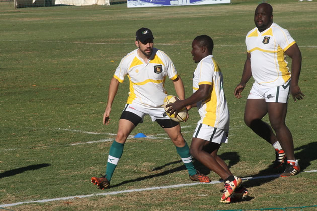 READY TO RUMBLE. . . The Sables duo of Jacques Leitao (left) and Tatenda Murwira (right) close in on Stephan Hunduza during the captain’s run at Prince Edward School yesterday ahead of their Africa Cup clash against Tunisia this afternoon.