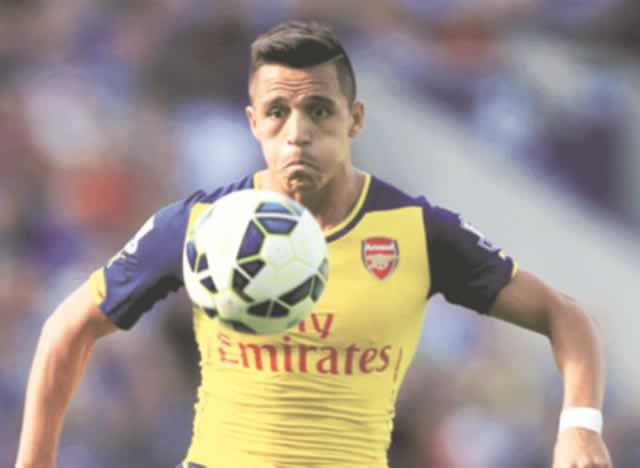 Sanchez curls the ball around the legs of Ryan Shawcross to score his first goal of the afternoon and put Arsenal into a 2-0 lead. — MailOnline