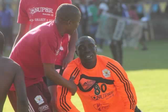 TEARS OF JOY . . . Shabanie Mine goalkeeper Victor Twaliki is helped off the ground by his teamates after going on his knees to celebrate their stunning win over Dynamos at Barbourfields yesterday