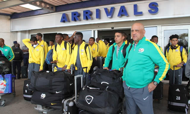 CALM BEFORE THE STORM . . . South Africa Under-23 team coach Owen Da Gama (right) and his men arrive at Harare International Airport yesterday ahead of tomorrow’s showdown against Zimbabwe at Rufaro