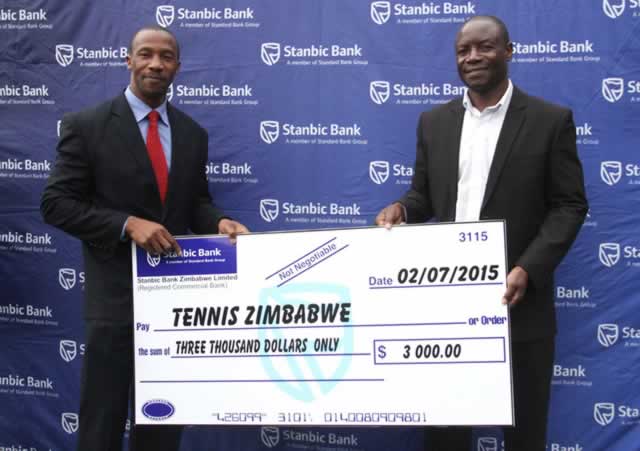 A HELPING HAND . . . Stanbic Bank head marketing and corporate affairs Palmer Mugavha (left) presents the cheque to TZ president Regis Bhunu yesterday at Harare Sports Club