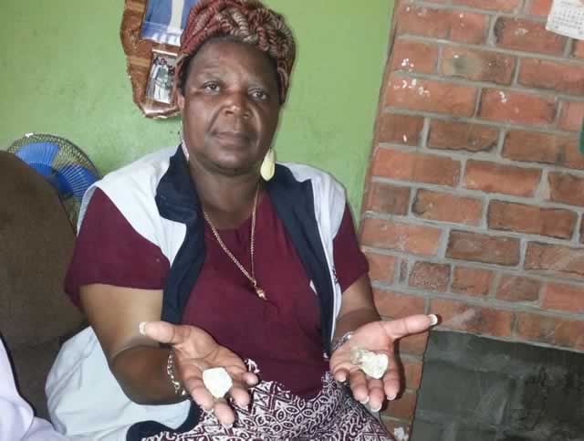 Senator Mawire shows some of the stones used in attacking her house in Mutare’s Chikanga Phase 2 early this morning