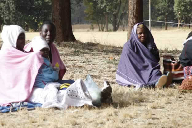 Some voters warming themselves before casting their votes in Mt Pleseant Harare today